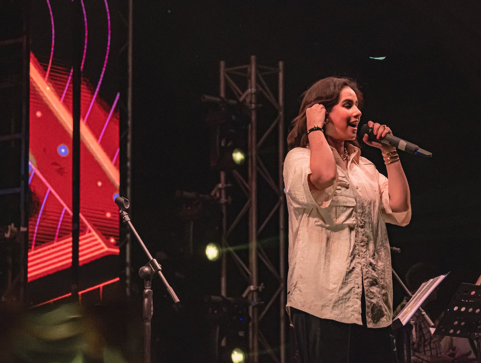 Zevela Creative event — vocalist under stage lights